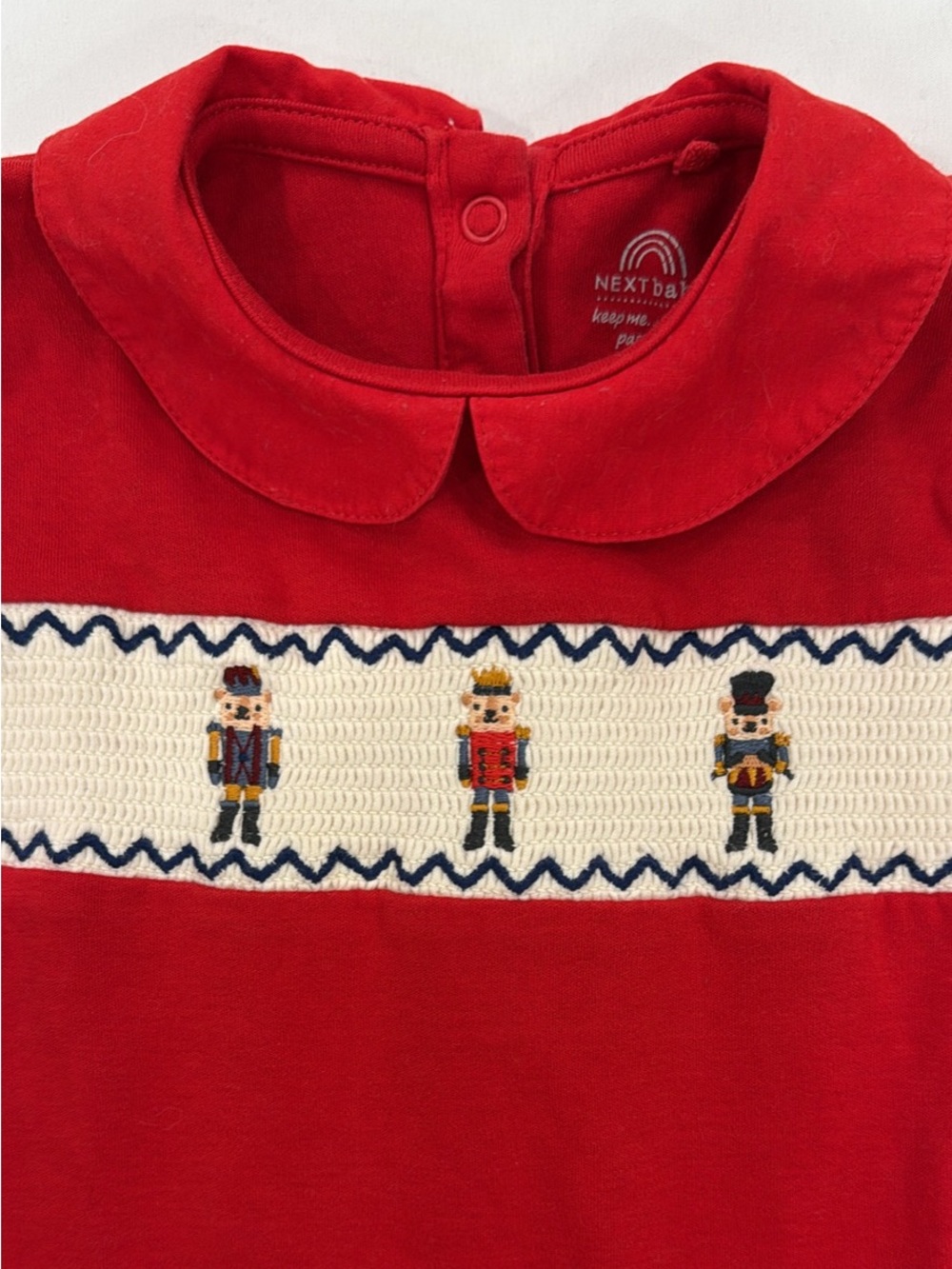 next Red Nutcracker Smocked Footie with Peter Pan Collar